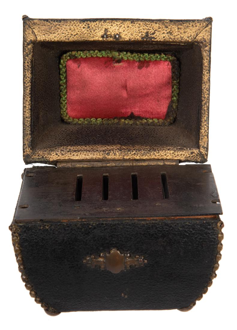 Coin Casket.: Coin Casket. New York: Otto Maurer [?], ca. 1880. Coins vanish from a small leather-covered box when the lid is opened and closed. Approx. 3 x 2 ¾ x 3 ¼”. Well worn and requiring new s