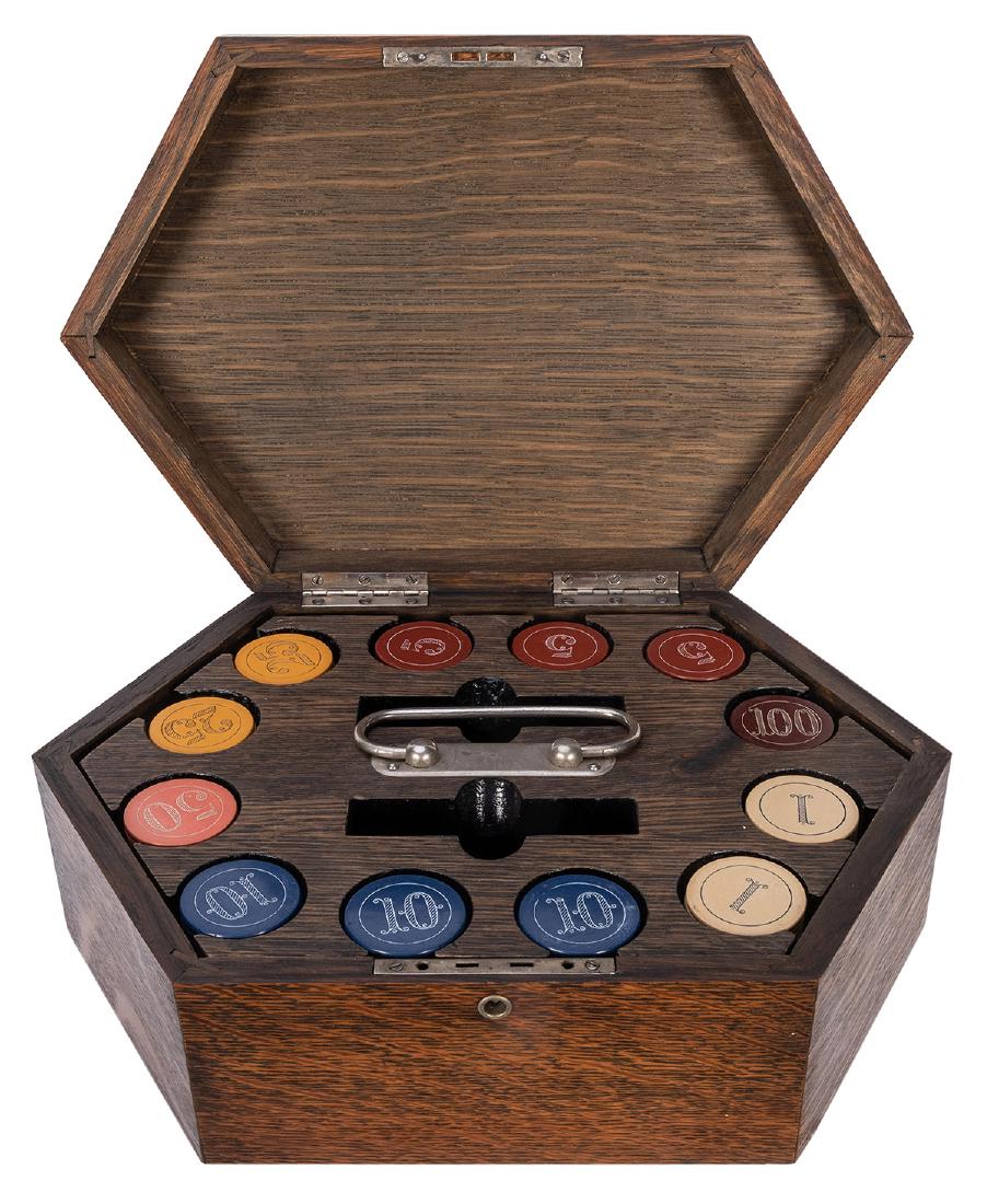Cased Set of Clay Poker Chips.: Cased Set of Clay Poker Chips. Antique hexagonal oak box with caddy of multi-color clay chips in denominations of 1, 5, 10, 25, 50, and 100. Slots for two card decks, nickel-plated handle. Lock and ke