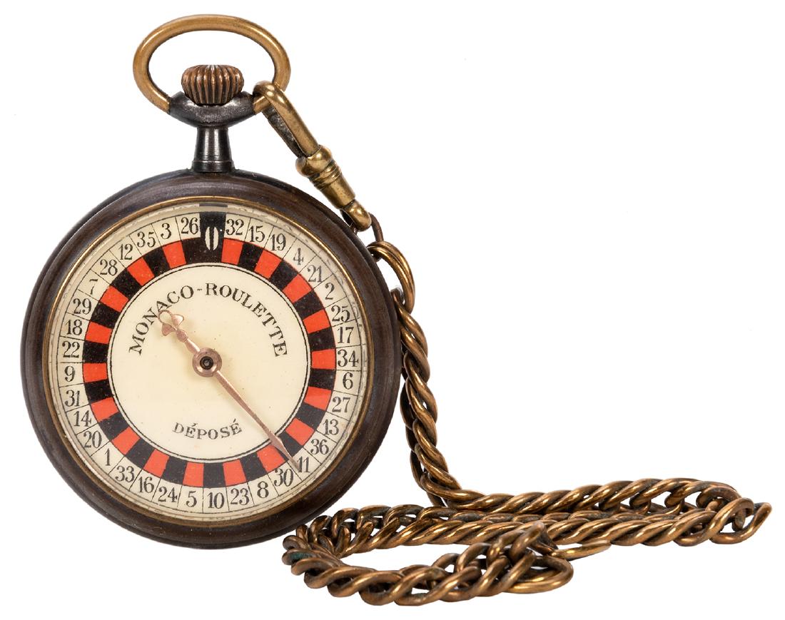 Roulette Pocket Watch.: Roulette Pocket Watch With Chain. French, ca. 1890s. Brass case with beveled glass and shellac dial. Press down on the stem and the dial spins. Together with leather pouch. Finish worn, else very good