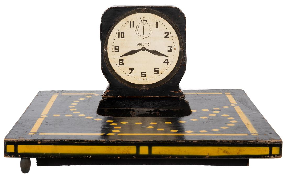 Vanishing Alarm Clock.: Vanishing Alarm Clock. Colon: Abbott’s Magic, ca. 1940s. An alarm clock resting on a wooden tray is lifted with a cloth, carried some distance away, and tossed into the air—it has vanished
