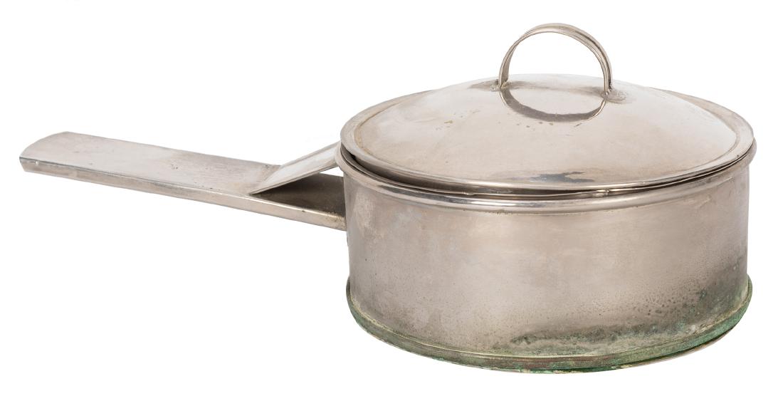 A Magical Mixture.: A Magical Mixture. Colon: Abbott’s Magic, ca. 1939. The magician pours cake batter into the small pan and lights a wad of paper on fire, inserting the wad into a borrowed hat and resting the pan