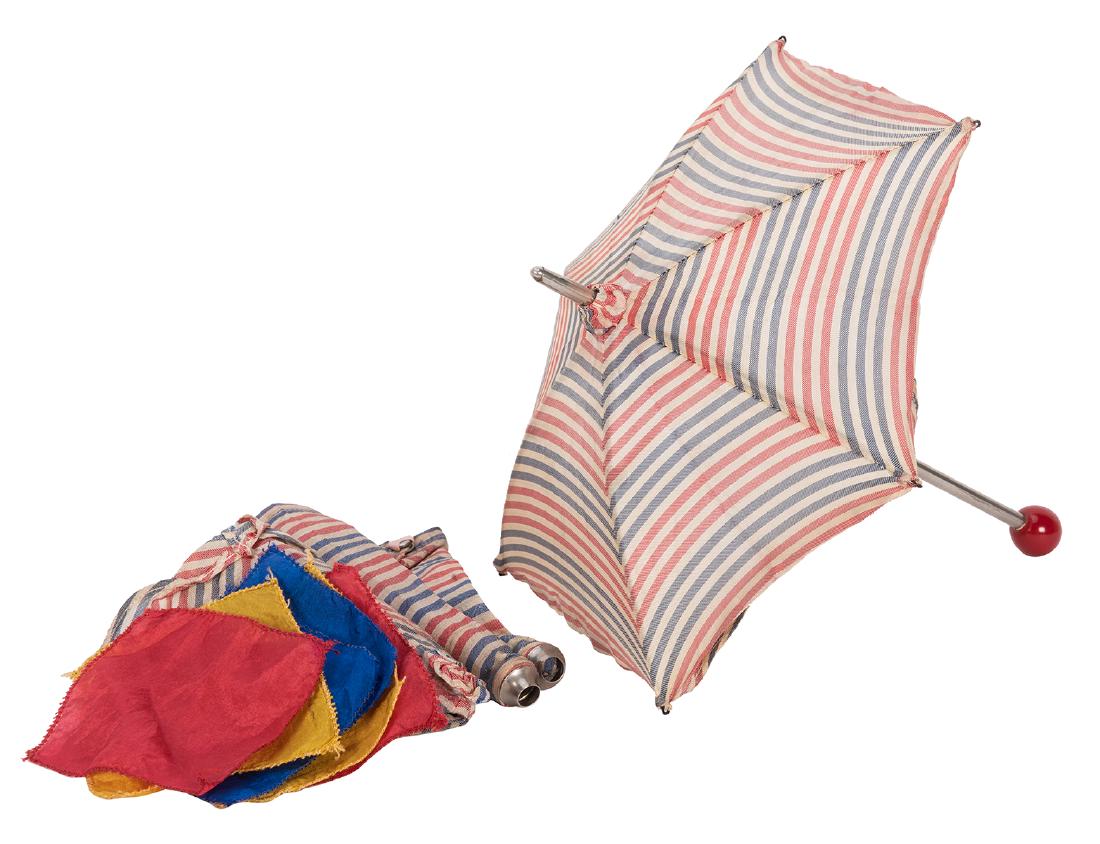 Micro Umbrella Illusion.: Micro Umbrella Illusion. New Haven: Petrie and Lewis (P&L), ca. 1950. Miniature version of the Mutilated Parasol effect in which loose handkerchiefs transpose locations with the cover of an umbrella. 