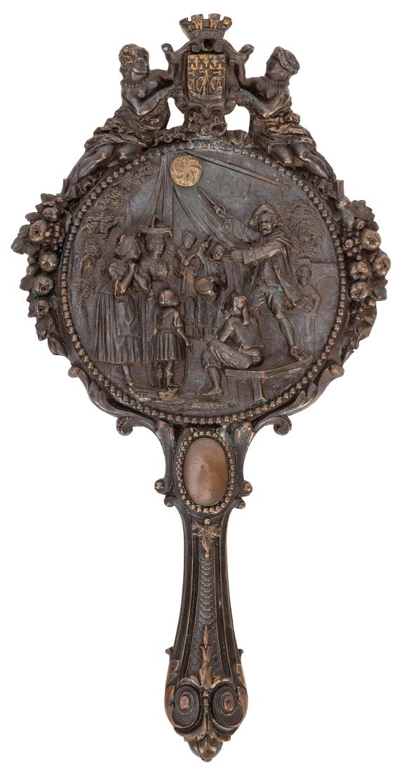 Bronze and Brass Magician Vanity Mirror.: Bronze and Brass Magician Vanity Mirror. French, 19th century. Vanity mirror with a highly detailed relief cast vignette in which a man holding a wand pulls back a curtain, lettered ″Magie,&Prim