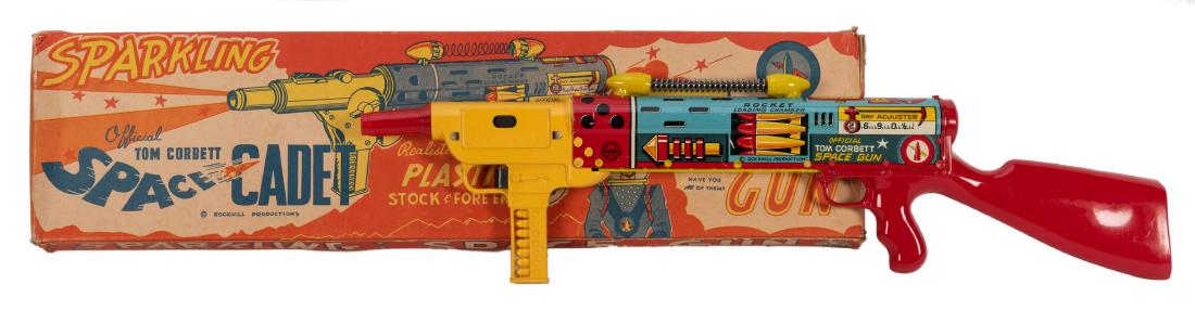 Marx Tom Corbett Space Cadet Gun in Original Box. New: Marx Tom Corbett Space Cadet Gun in Original Box. New York: Louis Marx, 1950s. Lithographed tin and plastic Space Cadet rifle in the scarce original pictorial cardboard box. A nice example with minima