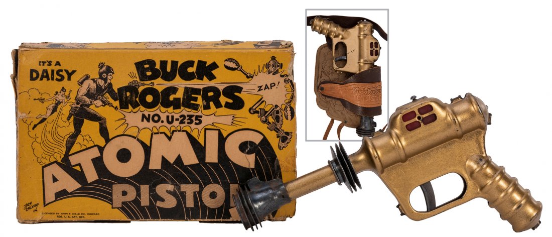 Buck Rogers Atomic Pistol in Original Box with Leather: Buck Rogers Atomic Pistol in Original Box with Leather Holster. 1935. Daisy; 10 ½Â”, copper finish pop gun with spark, a beautiful example in a scarce original box (G/VG, with some cracks an