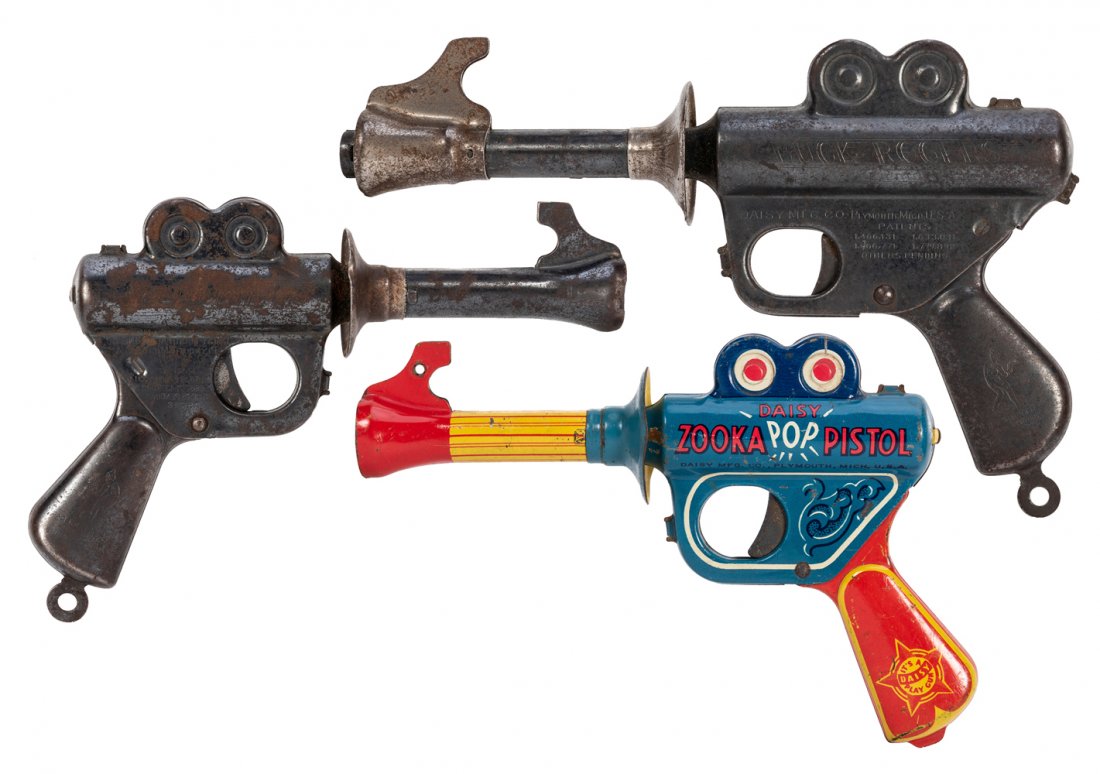 Trio of Daisy Toy Space Guns. Bucks Rogers/Zooka/Daisy.: Trio of Toy Space Guns. Bucks Rogers / Zooka Pop Pistol. Including two different Buck Rogers 25th Century Daisy pistols; and a lithographed Daisy Zooka Pop Pistol.