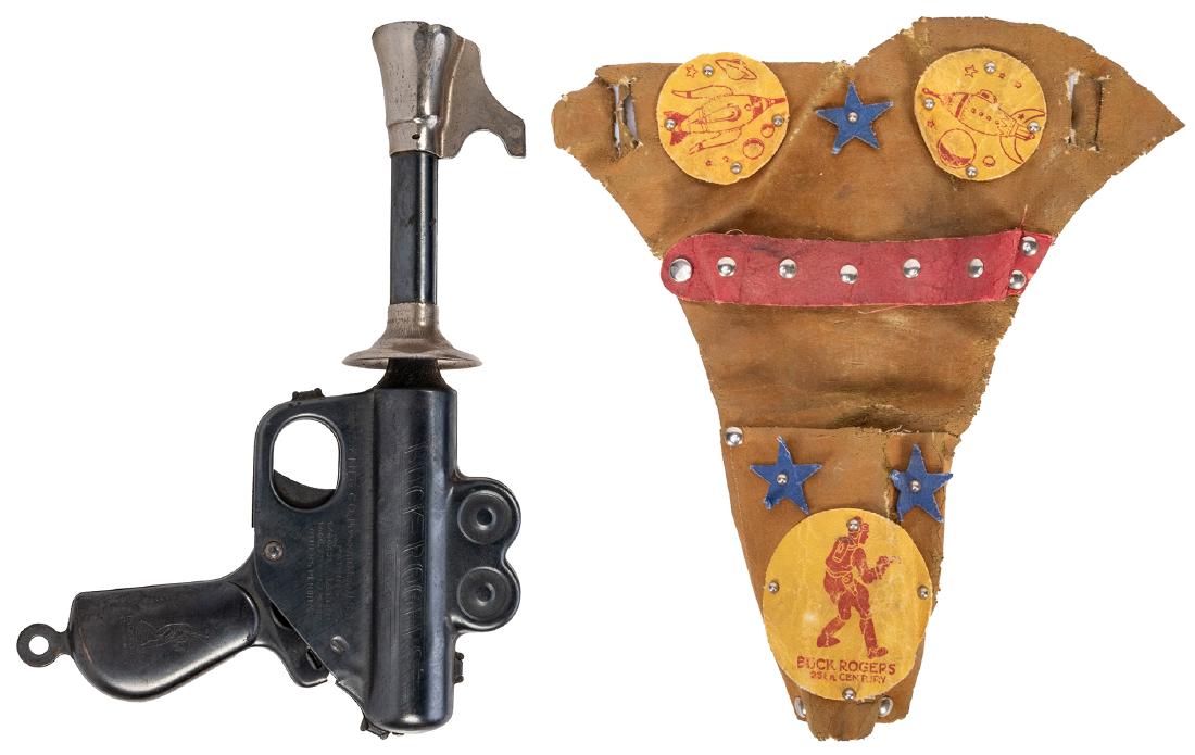 Buck Rogers XZ-31 Rocket Pistol with Holster. Plymouth,: Buck Rogers XZ-31 Rocket Pistol with Holster. Plymouth, MI: Daisy Mfg, ca. 1934. The first metal space gun or ray gun made, this gun is pressed steel with the name and manufacturer on the body of the 