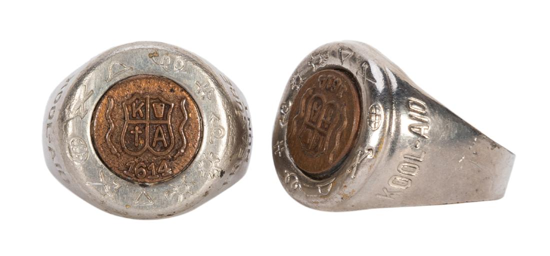 Kool-Aid Treasure Hunt Rings. 2 pcs. 1940. Silver: Kool-Aid Treasure Hunt Rings. 2 pcs. 1940. Silver luster adjustable band rings with secret symbols engraved on top with the date “1614.” Minor abrasions to band; original luster remains.