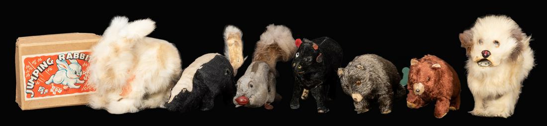 Lot of 7 Wind-Up Animal Toys.: Lot of 7 Wind-Up Animal Toys. Tin toys with fur and fabric bodies, including two bears (Modern Toys; both with Made in Japan/Occupied Japan paper labels); skunk; squirrel with nut; cow (Modern Toys; l