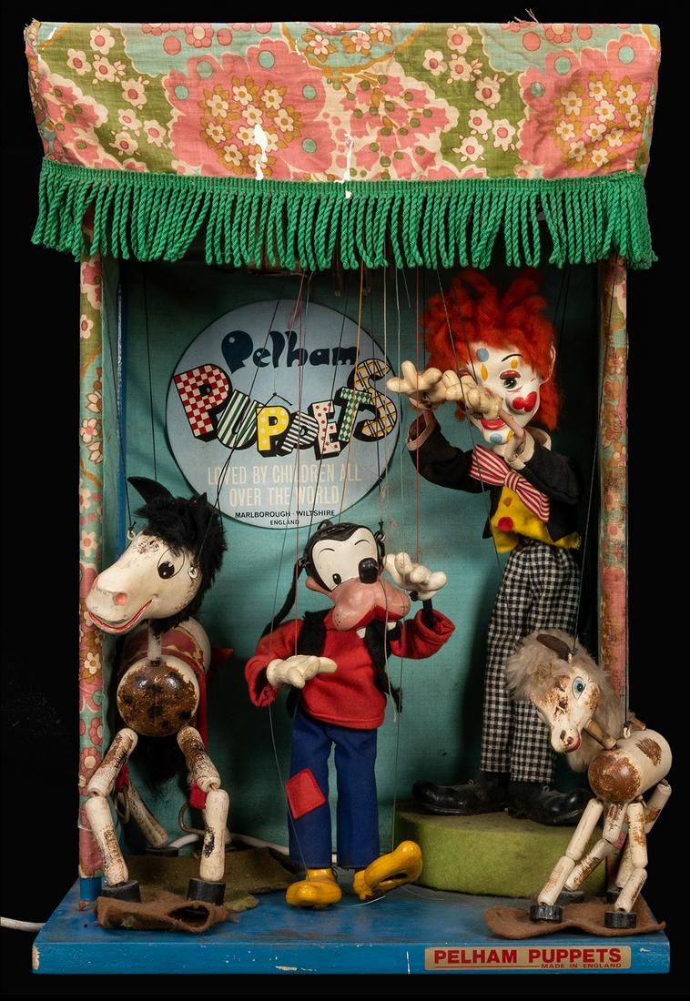 Pelham Puppets Animated Counter Display.: Pelham Puppets Animated Counter Display. England, ca. 1960s. Motorized electric puppet display including figures of Goofy, clown, horse, and pony. Wooden base with felt platforms, fabric canopy, Pelha
