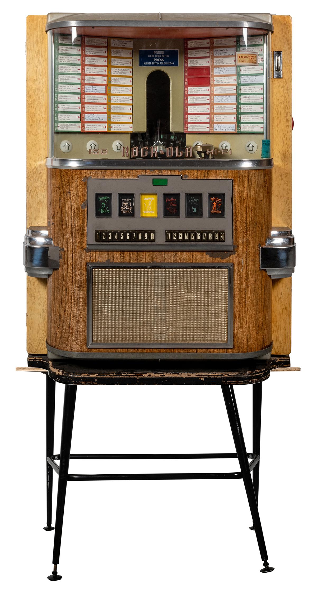 Rock-Ola 1958 Model 1464 Jukebox.: Rock-Ola 1958 Model 1464 Jukebox. Chicago, 1958. 120 selections. Plays 45 RPM records. 41 x 20 x 30”. Includes original stand but with replaced wooden top. Powers on, selector in working order. In e