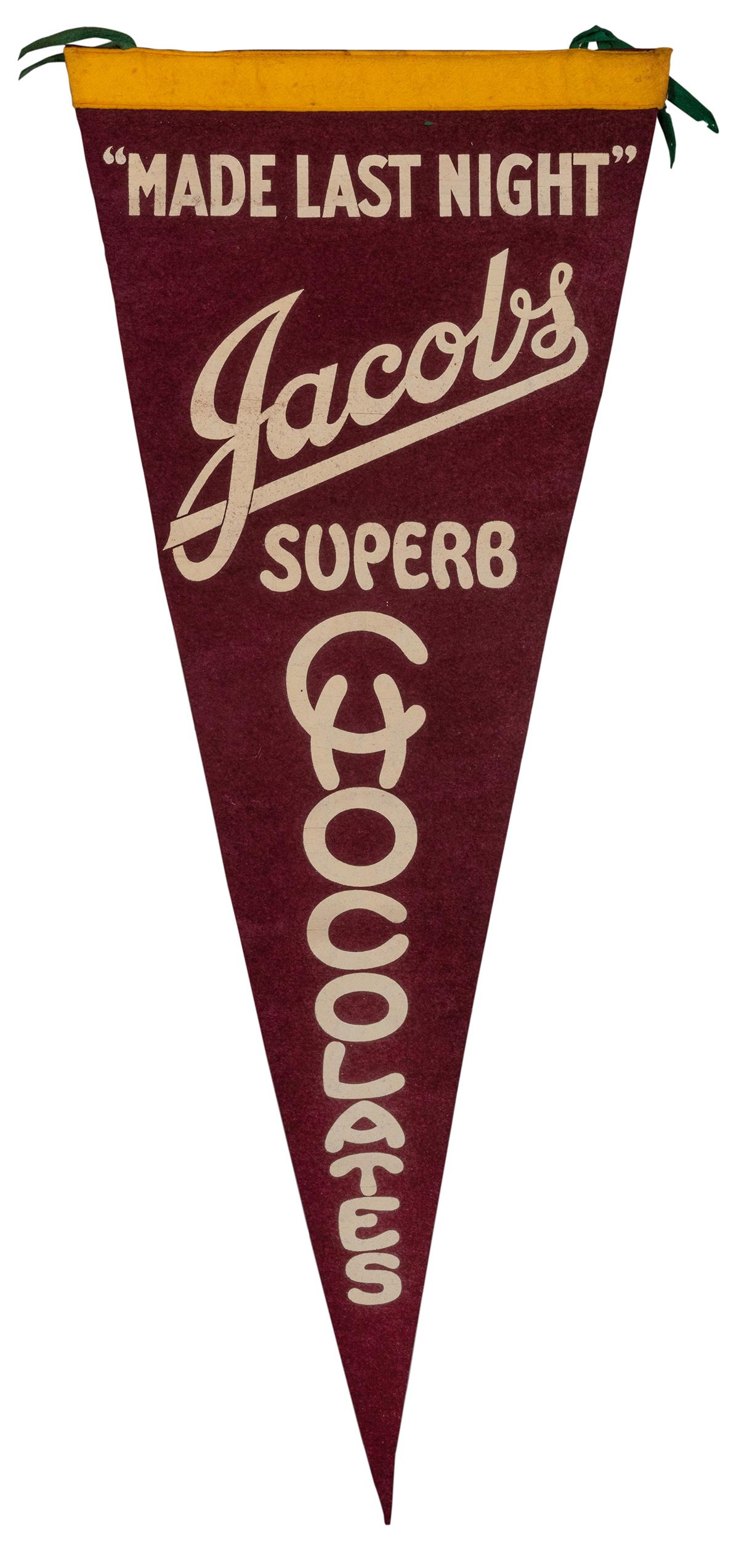 Jacobs Superb Chocolates Pennant.: Jacobs Superb Chocolates Pennant. Kalamazoo, MI: Merchanto Publishing Co., ca. 1920s. A deep purple felt souvenir pennant advertising Jacobs Chocolates, promised to be “Made Last Night.” L