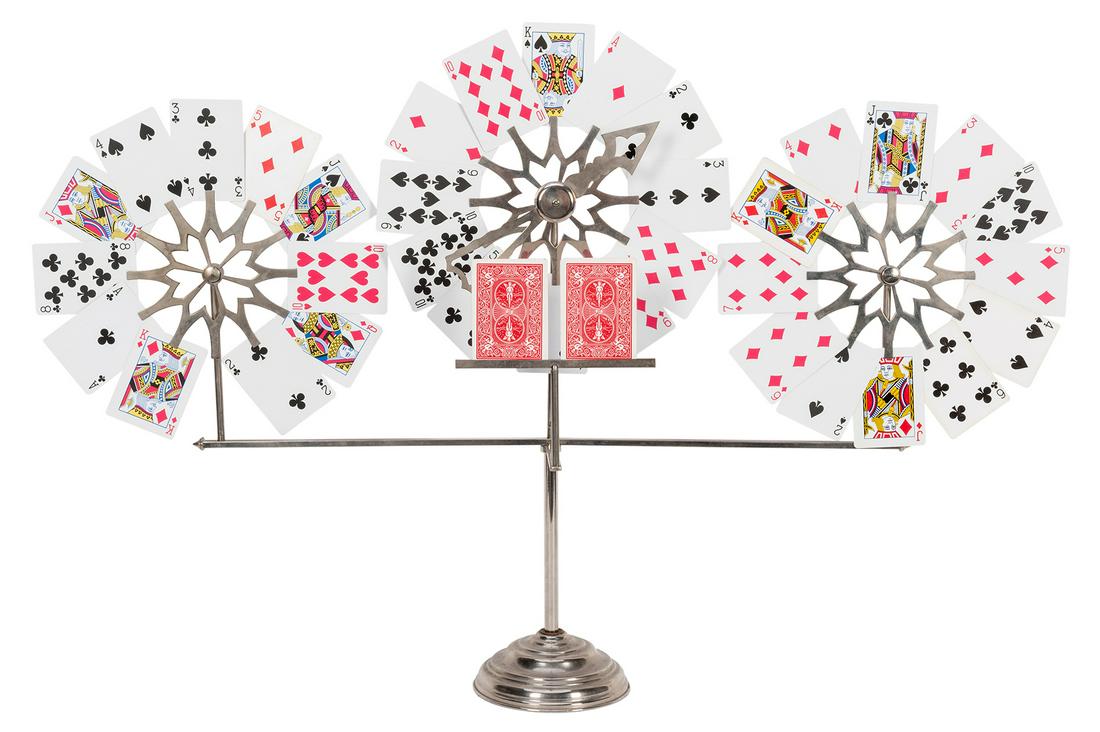 One Day Fly.: One Day Fly. Berlin: Conradi-Horster, ca. 1920. A spinning metal pointer is used to select one card on each of three wheels. These match three cards previously placed on the stand before the trick beg