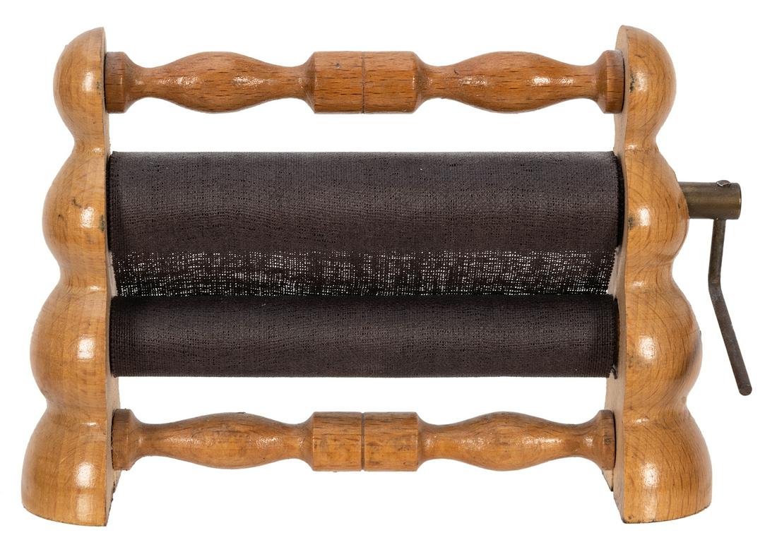 Money Maker.: Money Maker. Circa 1910. Blank paper cranked through the rollers becomes real currency. Turned wooden construction. Height 3 ¾”.