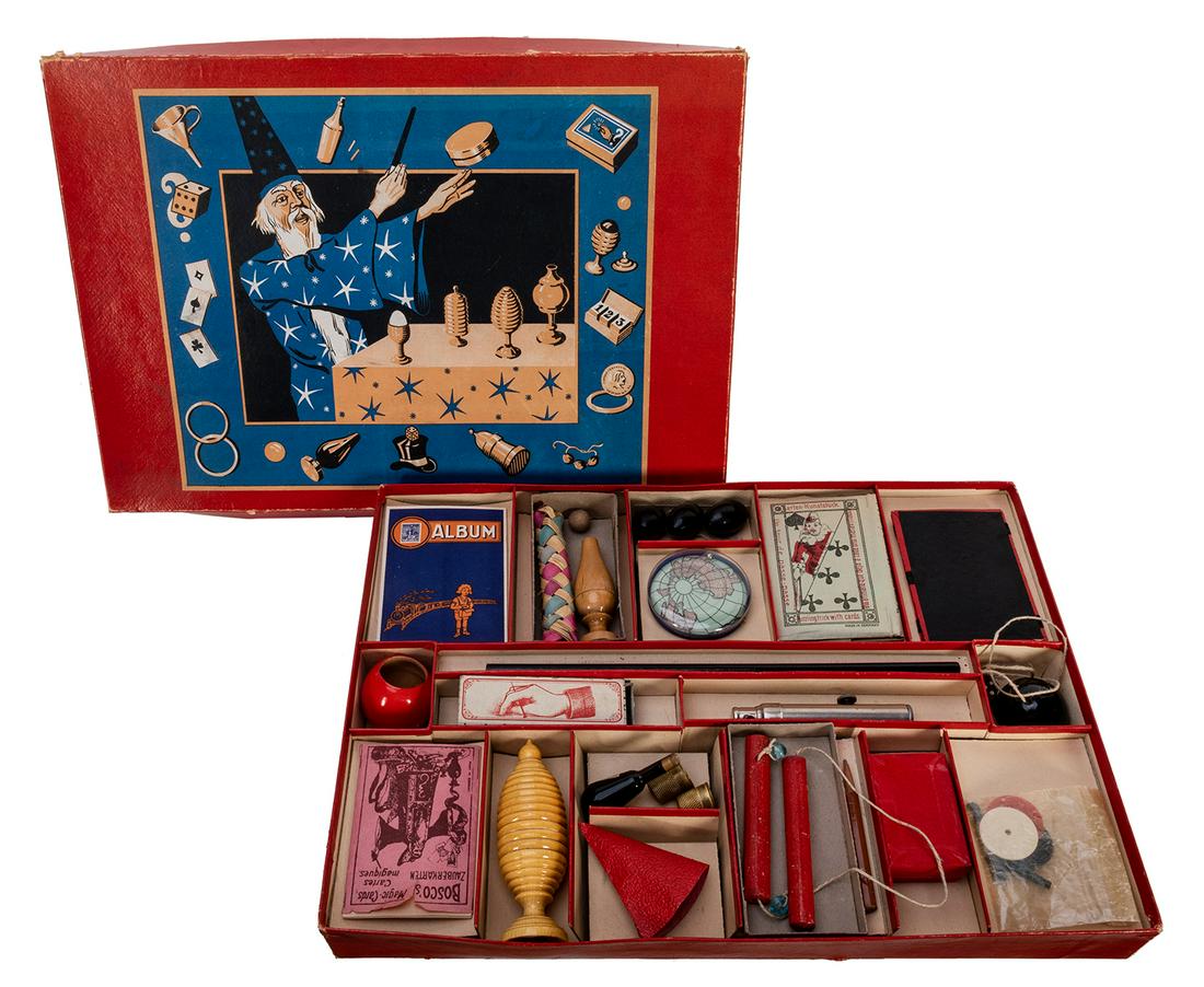 Vintage German Magic Set.: Vintage German Magic Set. Bavaria: Spear [?], ca. 1950. Attractive magic set includes Stamp Album, Nail Through Finger, thimbles, wooden Egg Vase, age cards, and more. Attractive label on lid. Box 15