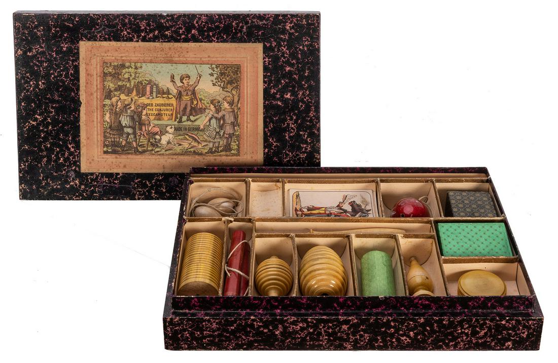 Der Zauberer. German Magic Set.: Der Zauberer. German Magic Set. Circa 1900. Handsome vintage set includes wood turned props, cards, and other cardboard tricks, among them a marble vase, coin box, wooden flower vase, and more. Lithog