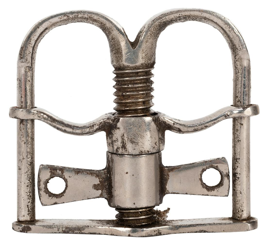 Thumb Cuff.: Thumb Cuff. Circa 1920. Nickel plated thumb restraint. 2 ¾ x 2 ½”. Minor wear to plating. Working.