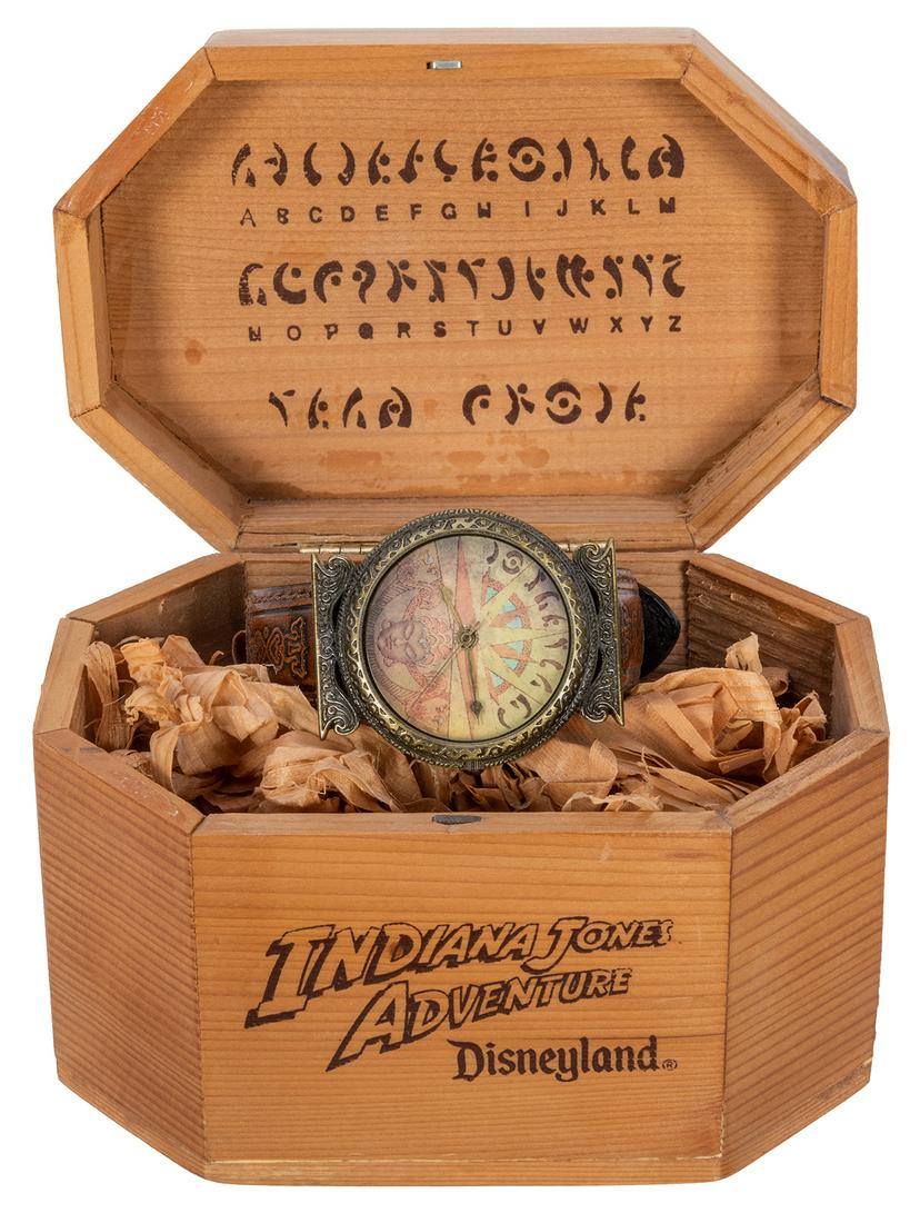 Indiana Jones Adventure Cast Watch in Wooden Box.: Indiana Jones Adventure Cast Watch in Wooden Box. Wristwatch sold to castmembers with beautiful full color Mara art on the face which comes in a wooden box with hinged lid filled with wooden shavings.