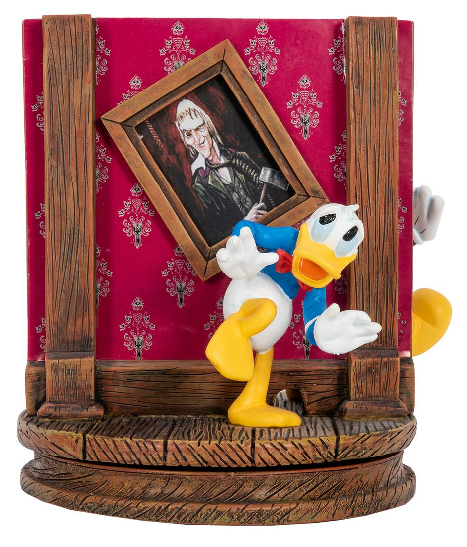 Haunted Mansion Sculpture with Mickey Mouse, Goofy, and: Haunted Mansion Sculpture with Mickey Mouse, Goofy, and Donald Duck. Sculpture of Donald hiding in the Haunted Mansion in front of the ax man portrait in the Corridor of Doors. Sculpture rotates to re