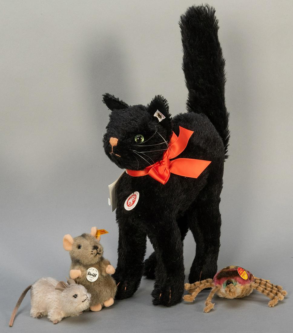 Steiff Black Cat and Scary Creatures Group. Scary and: Steiff Black Cat and Scary Creatures Group. Scary and Halloween-themed Steiff figures, including Scary Cat (682513; number 208 of 1,500), height with tail 17”; Piff Maus (056222), 4”; Spid