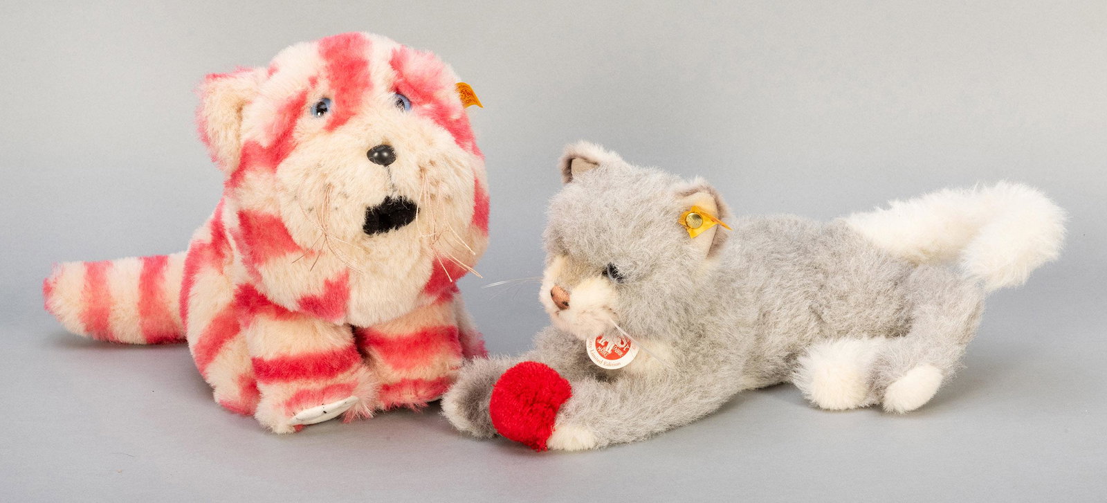 Pair of Steiff Cats. Including Kitty limited edition: Pair of Steiff Cats. Including Kitty limited edition (musical), yellow tag, without EAN or limitation on verso (for 2010 edition), length 12”; and Bagpuss Danbury Mint (yellow tag, EAN 662294), 