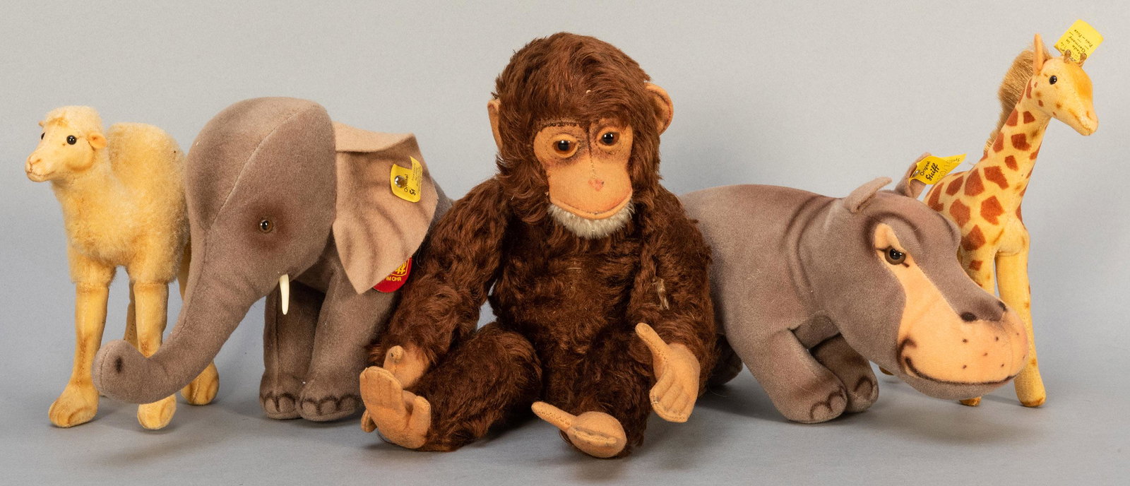 Steiff Vintage African Animals Small and Miniature: Steiff Vintage African Animals Small and Miniature Group. Five pieces, including velvet Trampy elephant with ID and ear tag; Mockie hippo with ear tag; vintage mohair Jocko with pin in ear; mohair/vel