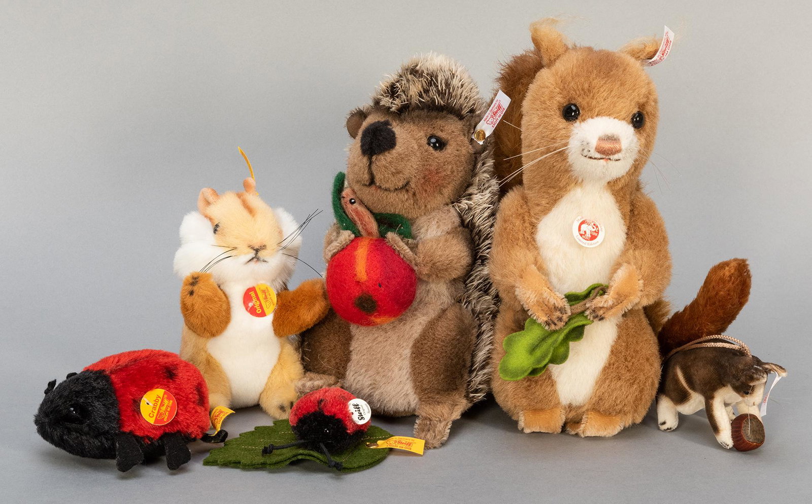 Steiff Squirrels and Woodland Animals Group. Including: Steiff Squirrels and Woodland Animals Group. Including Kecki musical squirrel with moving tail (number 78 of 2,009; EAN 038761), 9”; Squirrel ornament (number 152 of 1,901; EAN 668593); Sigi mus
