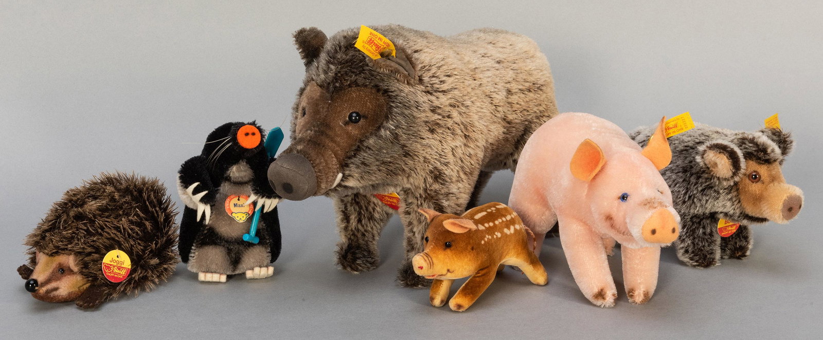 Steiff Boars, Pig, and Hedgehog Group. Six animals,: Steiff Boars, Pig, and Hedgehog Group. Six animals, including vintage Joggi hedgehog (5”), with name tag; vintage wild boar velvet miniature (4 ½”); Lucky Pig (EAN 035227; 6”); 