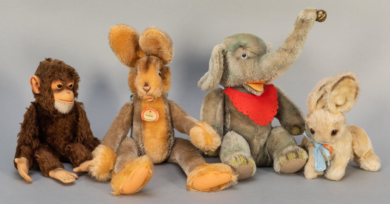 Vintage Steiff Animals Group. Including Jocko (11”: Vintage Steiff Animals Group. Including Jocko (11”); Lulac rabbit (15”); Jumbo sitting elephant with bib and bell (seated 8”); and rabbit (7”). Lulac and the other rabbit retai