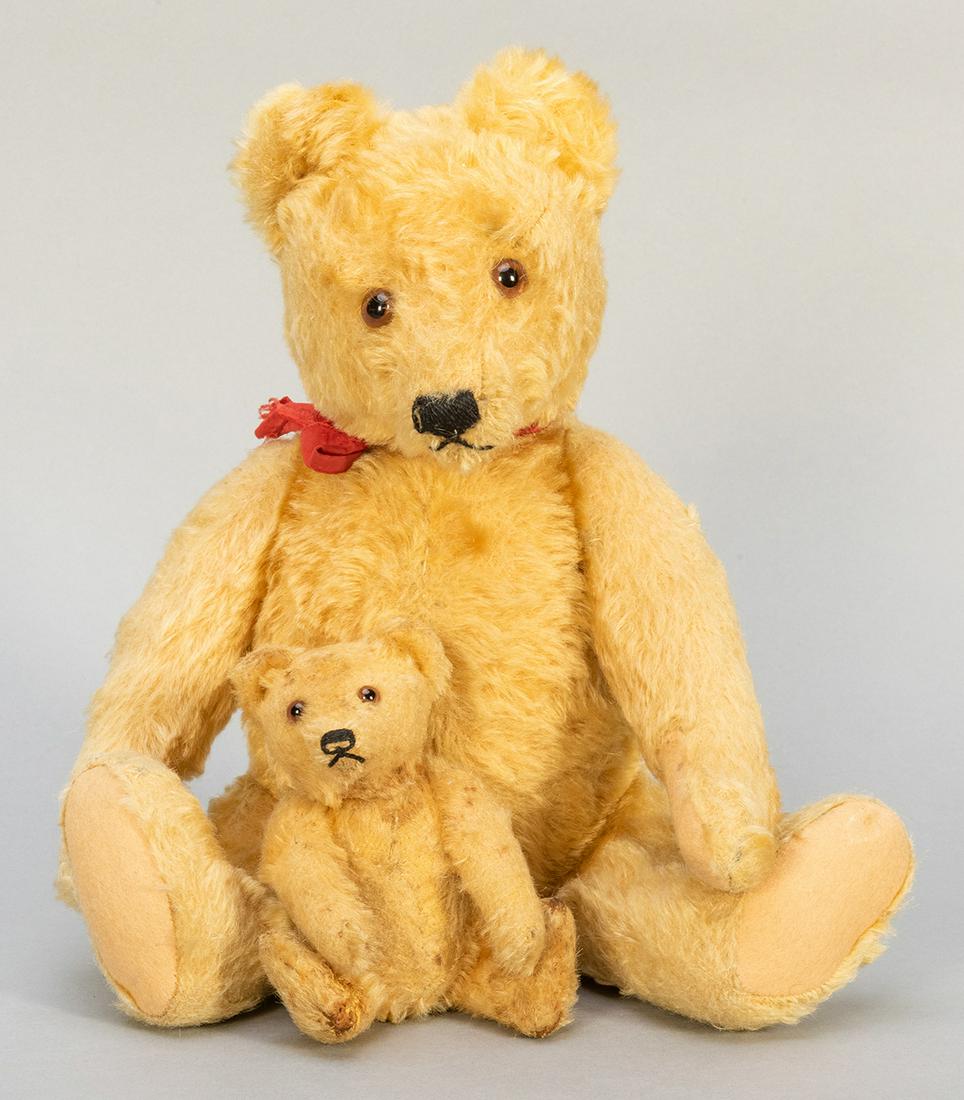Steiff Pair of 1950s Teddy Bears. Germany, 1950s. Pair: Steiff Pair of 1950s Teddy Bears. Germany, 1950s. Pair of classic light blond mohair teddy bears, sizes 14” and 5”. Caramel glass eyes. Fur loss on the smaller figure, occasional matting, 