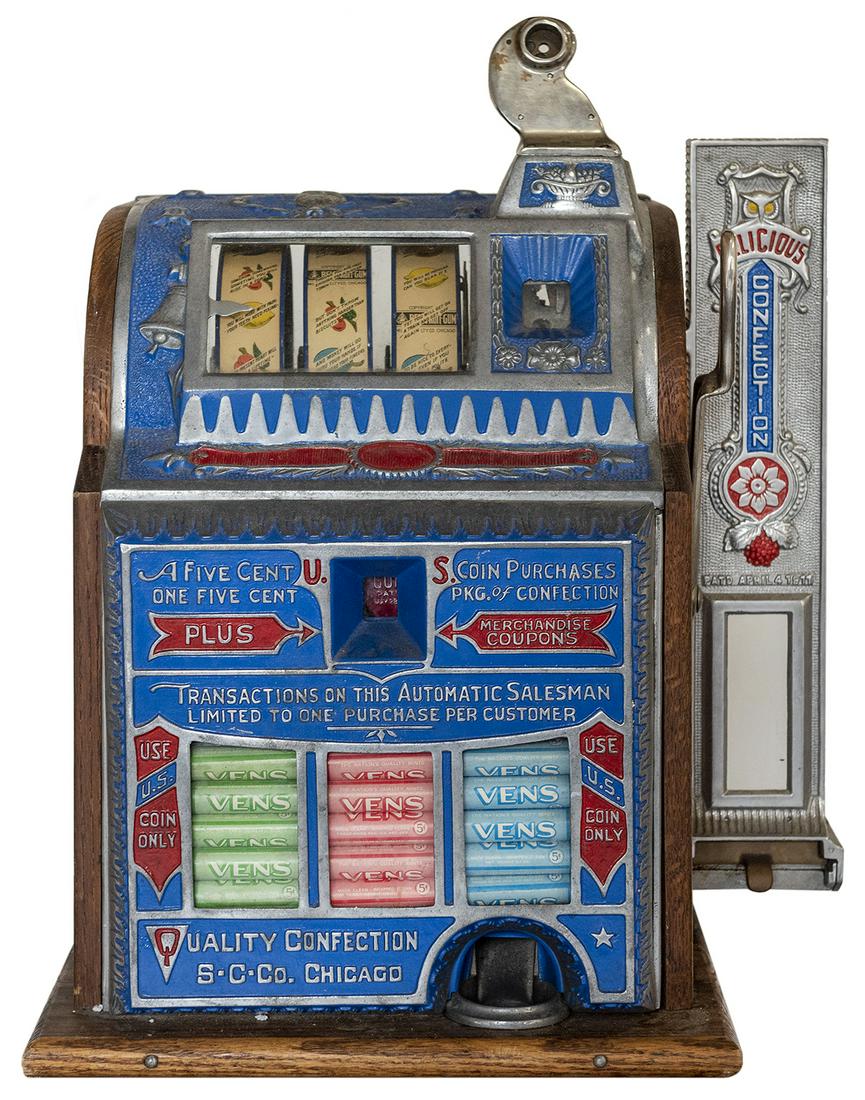 Superior Confection 5 Cent Slot Machine with Side: Superior Confection 5 Cent Slot Machine with Side Vendor. Chicago, 1920s. Three-reel slot machine which dispenses Vens and also features an attached side vendor. Lacking locks and keys to doors on bac
