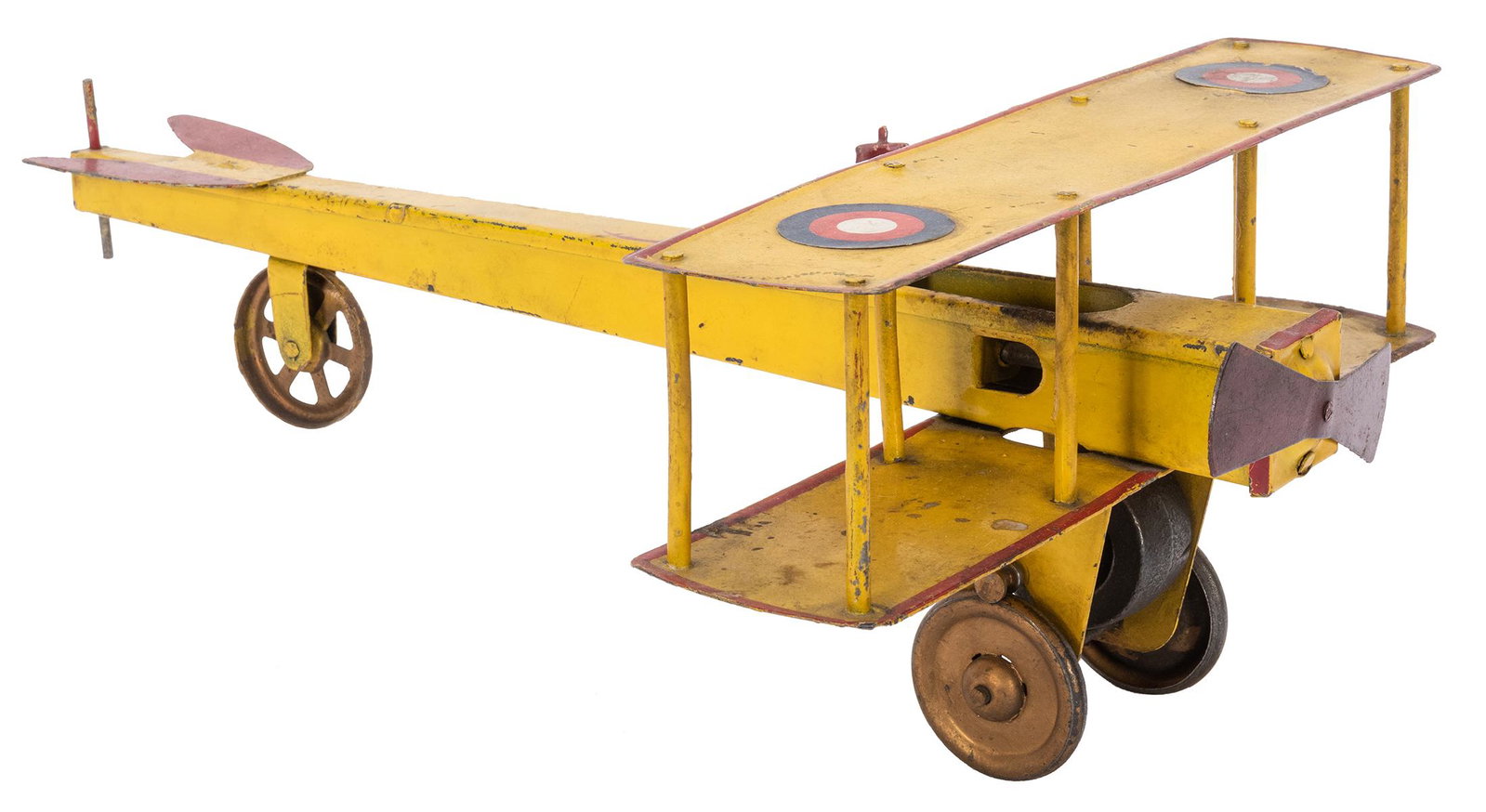 Dayton Bi-Wing Airplane. Length 15”. Front left: Dayton Bi-Wing Airplane. Length 15”. Front left wheel defective. Lacks rear vertical wing. Some repainting. Retains original pilot figure. Fair.