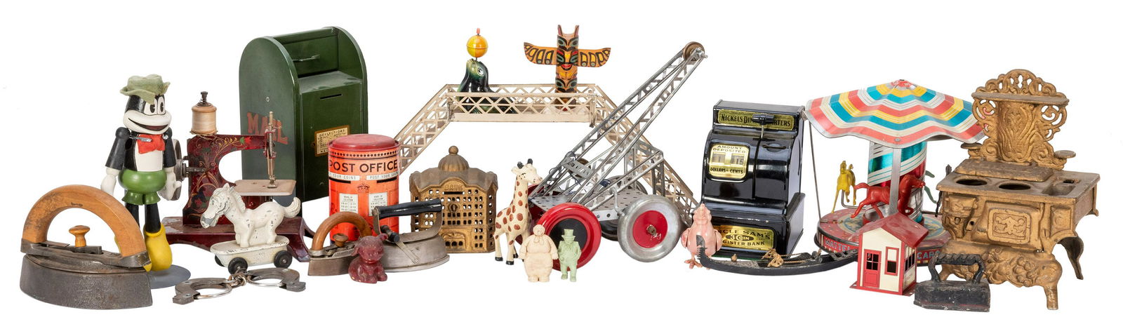 Large Assortment of Miscellaneous Vintage Toys and: Large Assortment of Miscellaneous Vintage Toys and Parts. Including several tin banks; Erector Set parts and booklet; children’s irons; Lincoln logs; Mattel Music Box Carousel; miniature sewing