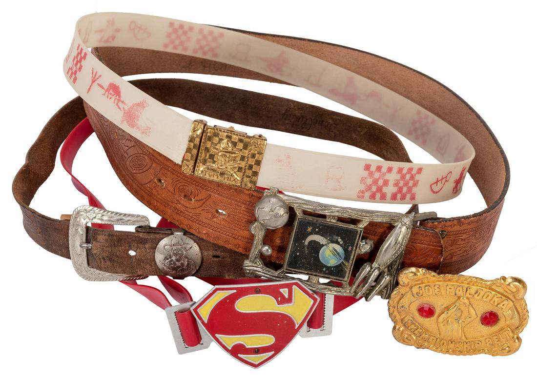 Lot of 5 Premium Belts and Buckles. Superman, Tom Mix,: Lot of 5 Premium Belts and Buckles. Superman, Tom Mix, Buck Rogers, and Others. Circa 1940s/50s. Lot includes a Buck Rogers Space Ranger punch-detailed leather belt and pot metal buckle with lenticula