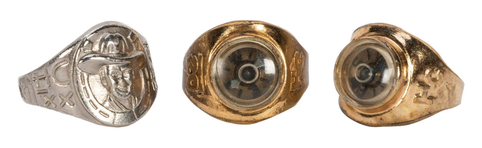 Hopalong Cassidy Premium Rings. 3 pcs. Circa 1950s.: Hopalong Cassidy Premium Rings. 3 pcs. Circa 1950s. Post Cereal premiums include removable hat and compass rings; one with black metal hat and one without. Minor tarnishing, few scratches to hat; orig