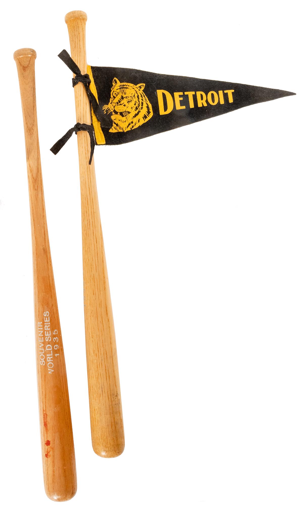 Pair of 1935 World Series Souvenir Mini Baseball Bats.: Pair of 1935 World Series Souvenir Mini Baseball Bats. Each stamped in silver “Souvenir World Series 1935”. One bat included with a miniature Detroit Tigers felt pennant. Length 17 ½&