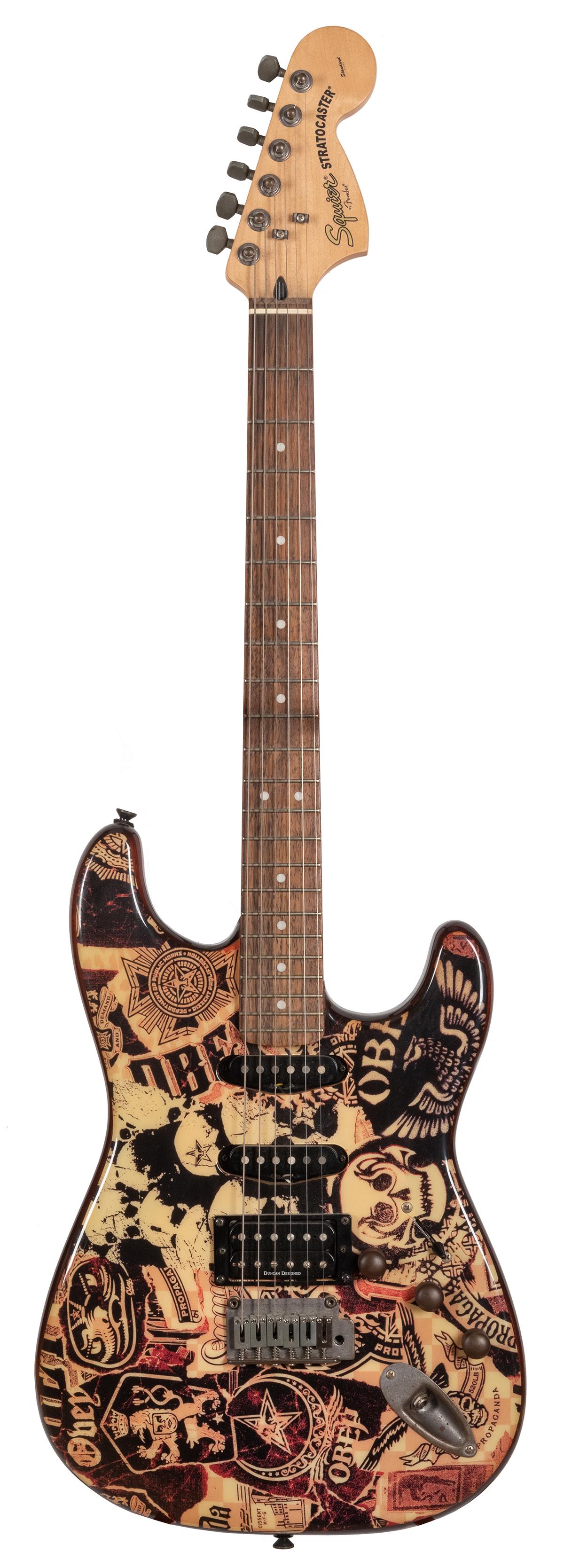 Squire “Obey” Electric Guitar. Shepard: Squire “Obey” Electric Guitar. Shepard Fairey, 2005. Agathis body, maple neck, rosewood fingerboard, unplated hardware, diecast machine heads, single coil magnet pickups, Duncan designed h
