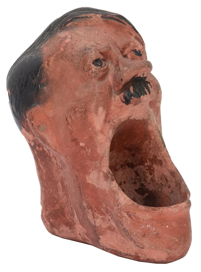 [WWII] Hitler Anti-Axis Figural Plaster Ashtray.: [WWII] Hitler Anti-Axis Figural Plaster Ashtray. Bassons Dummy Products, 1942. Height 5 ¾”. Soiling and surface chipping; good.