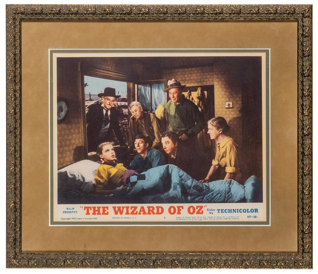 The Wizard of Oz Lobby Card. MGM, 1955. Original: The Wizard of Oz Lobby Card. MGM, 1955. Original colored lobby card. Starring Judy Garland. Framed 16 x 19.