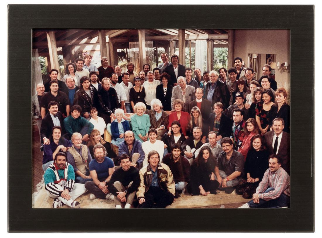 Rue McClanahan’s Photograph of Cast and Crew of: Rue McClanahan’s Photograph of Cast and Crew of The Golden Girls. Circa 1990. McClanahan’s personally owned color photo of actors from the show alongside backstage personnel. It was an ann