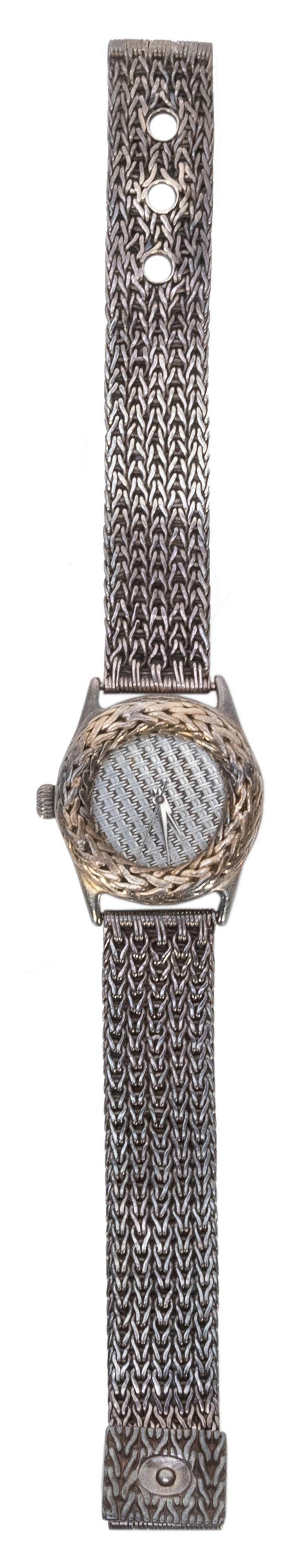 John Hardy Sterling Silver Watch. Swiss-made sterling: John Hardy Sterling Silver Watch. Swiss-made sterling silver watch with woven and cross-hatched band, face, and case design. Marked “The John Hardy Collection / For Swiss Watch Corporation”