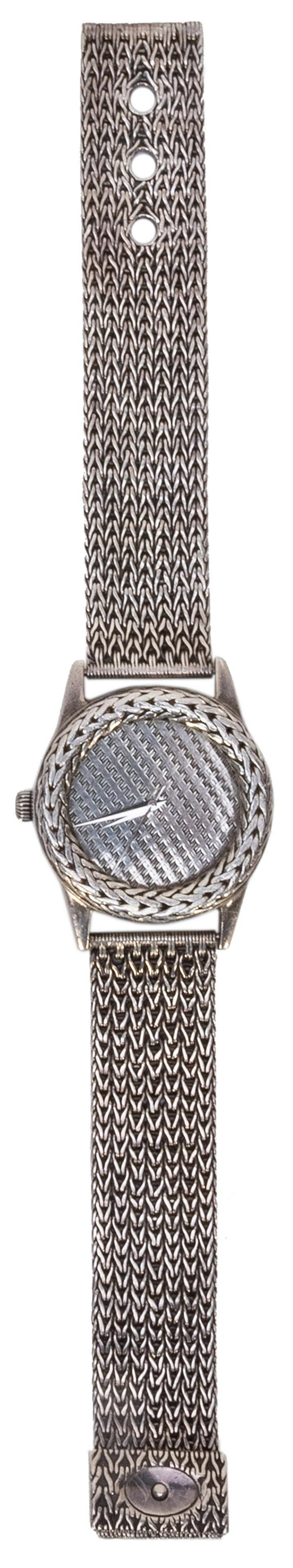 John Hardy Sterling Silver Watch. Swiss-made sterling: John Hardy Sterling Silver Watch. Swiss-made sterling silver watch with woven and cross-hatched design. Marked “The John Hardy Collection / For Swiss Watch Corporation” and numbered 4874.