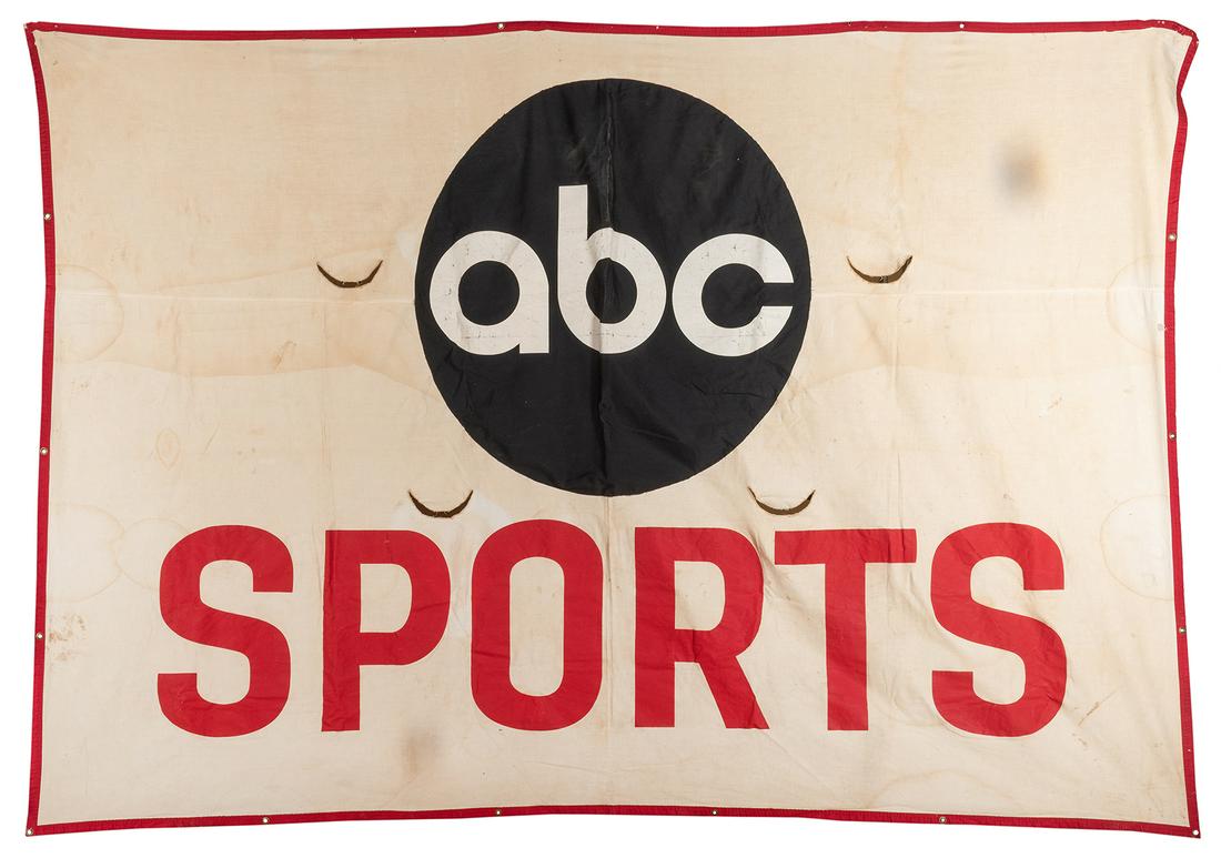 Massive ABC Sports Cloth Advertising Banner. Television: Massive ABC Sports Cloth Advertising Banner. Television sporting event banner in red, white, and dark blue fabrics, with grommets at each corner. 112 x 76”. Minor soiling; good condition overall