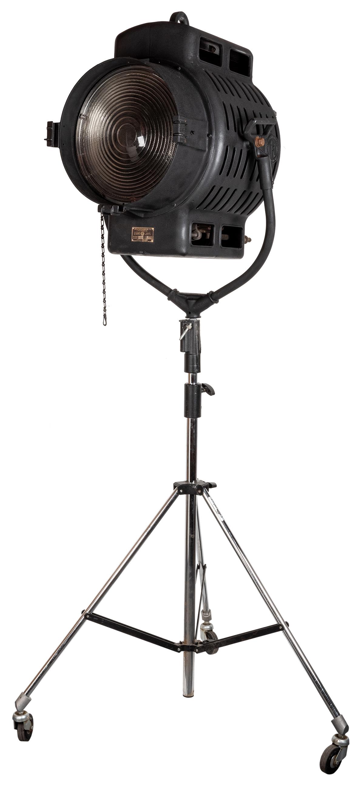 Mole-Richardson Type 214 Senior Solar Spot Lamp.: Mole-Richardson Type 214 Senior Solar Spot Lamp. Hollywood, ca. 1930s. 5000-watt studio stage light with MR logo, multi-color cycle. Includes tripod. Lens diameter 13 ½”, height of lamp (no