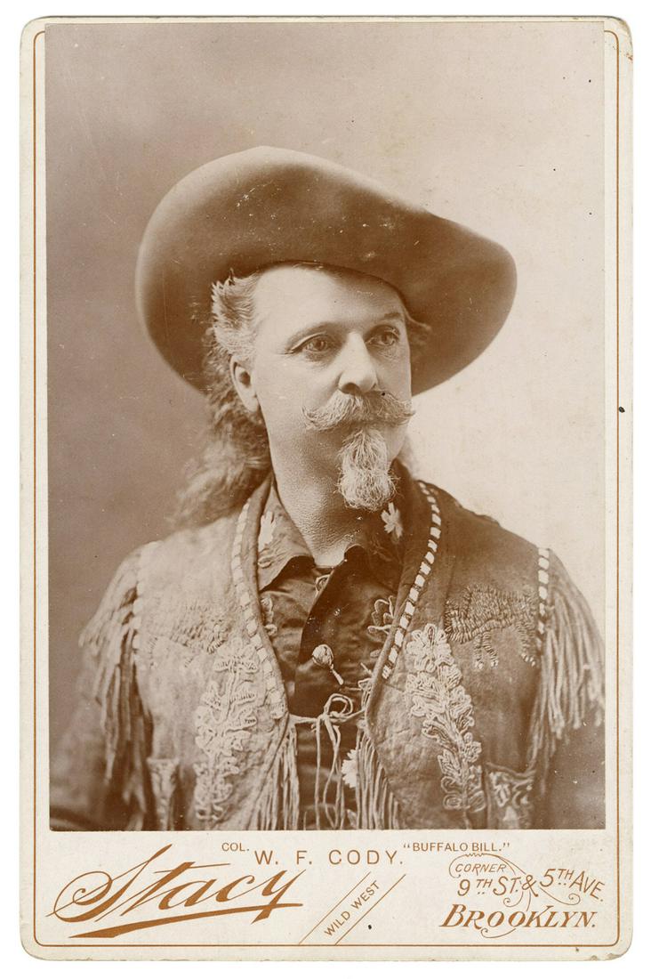 Cody, William F. (Buffalo Bill). Buffalo Bill Cabinet: Cody, William F. (Buffalo Bill). Buffalo Bill Cabinet Card Photograph. Brooklyn: Stacy, ca. 1900s. Studio portrait of Cody in a florally embroidered Western outfit. 6 ½ x 4 ¼”. Few lig