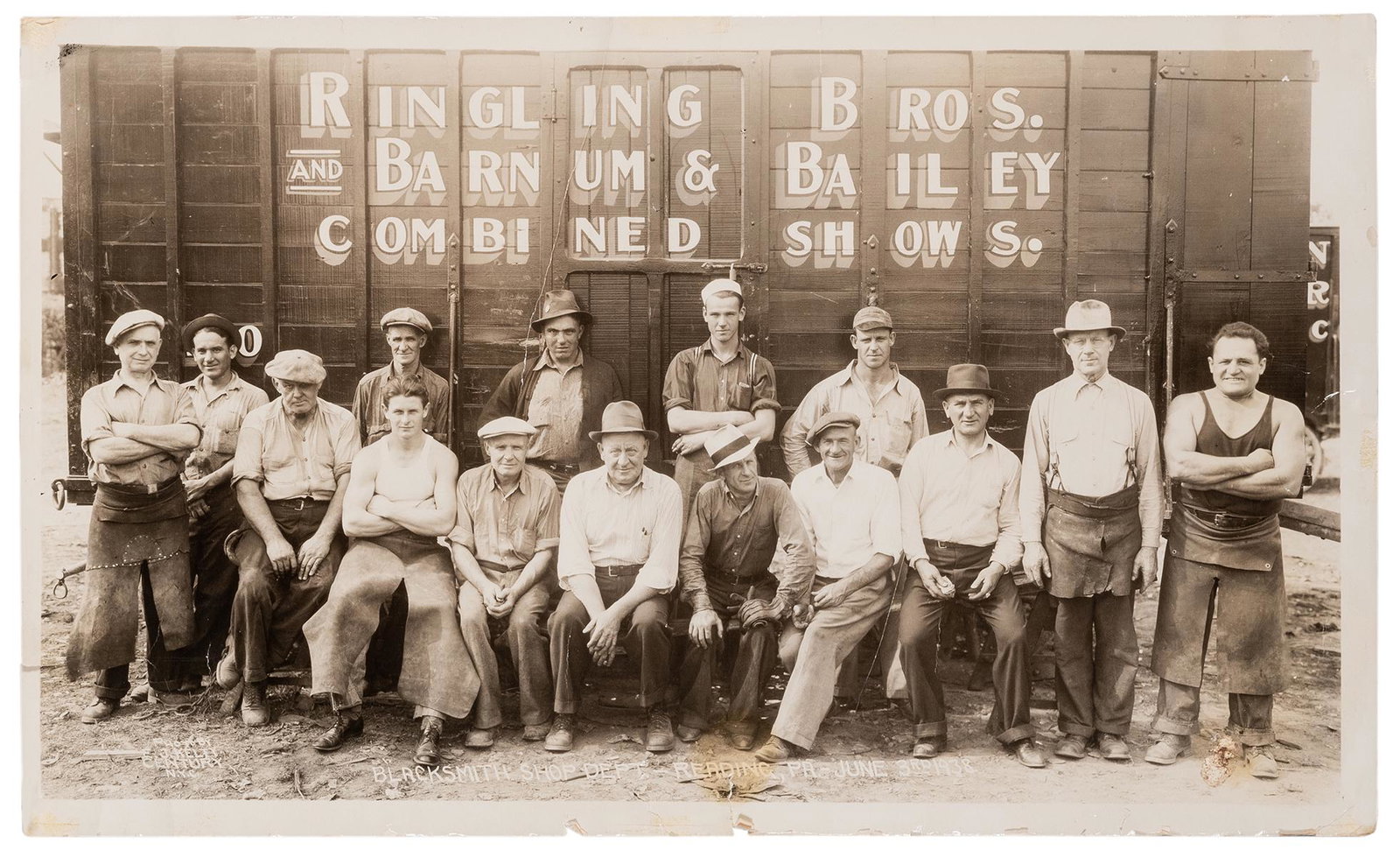 Kelty, Edward J. (1888—1967). Ringling Bros. and Barnum: Kelty, Edward J. (1888—1967). Ringling Bros. and Barnum & Bailey. Blacksmith Shop Dept. 1938. Silver print with title, credit, and date in negative. 12 x 20”. Rolled; with heavy tears and 