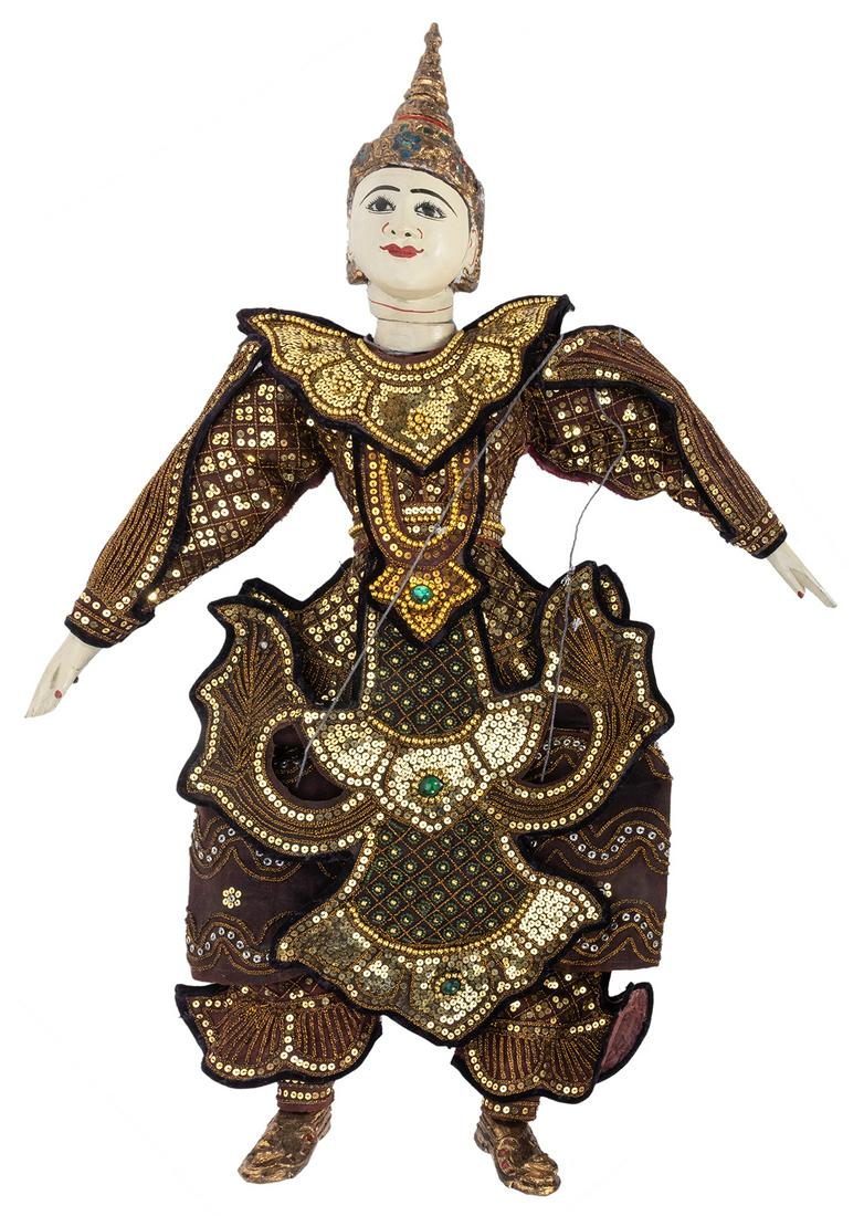 Indonesian Marionette Dancer. Painted wood, cloth with: Indonesian Marionette Dancer. Painted wood, cloth with sequin and jewel outfit. Attached with control bar. Height 29”.