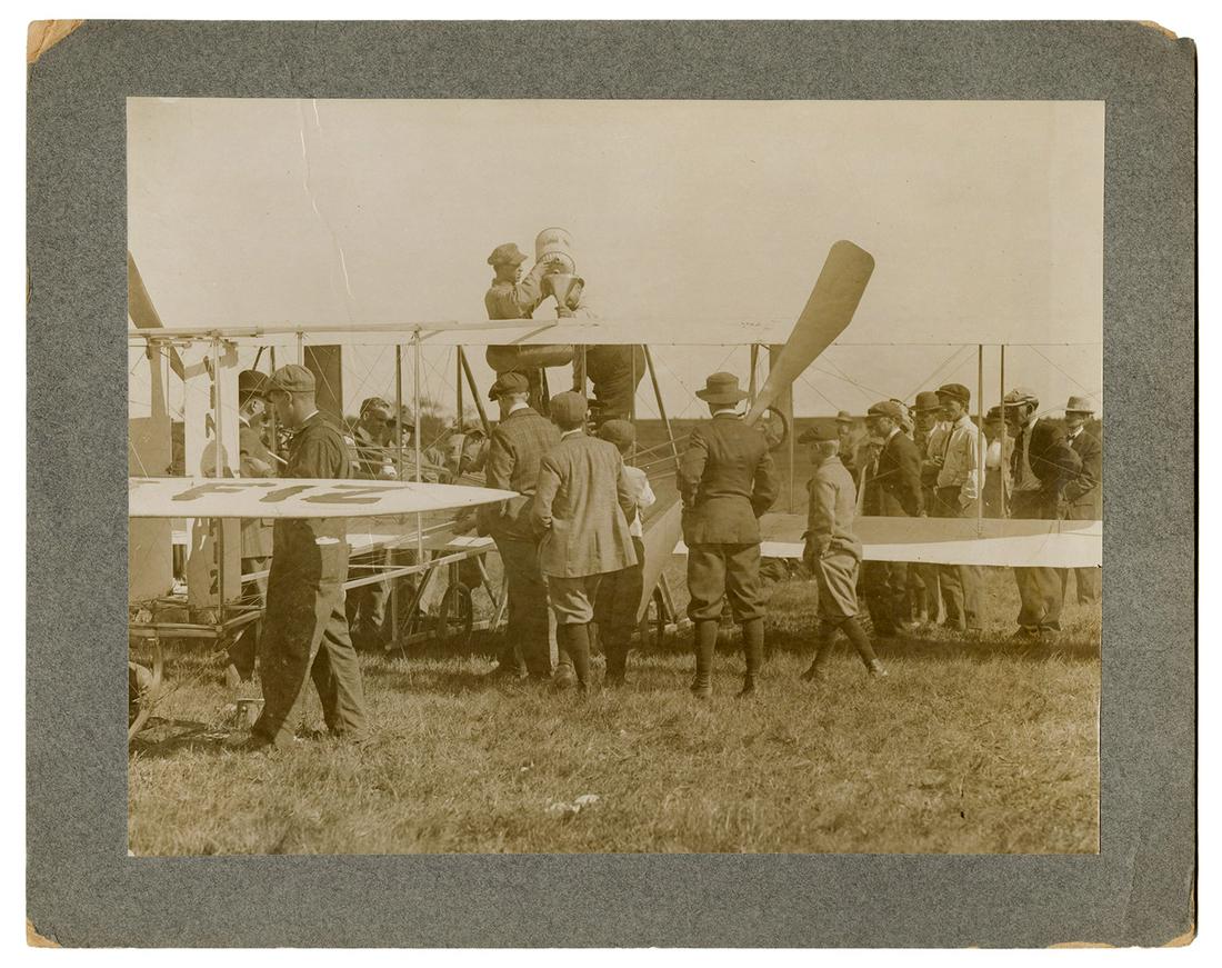 Photograph of a Curtiss Biplane at Sheepshead, NY.: Photograph of a Curtiss Biplane at Sheepshead, NY. 1910. Shortly after this photograph was taken, this Curtiss biplane, attempting to fly from Sheepshead to Staten Island, crashed into the ocean. 8 ¼