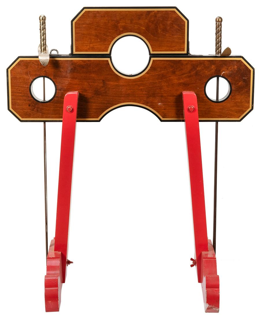 Demon of Doom. Azusa: Owen Magic Supreme, 1990s.: Demon of Doom. Azusa: Owen Magic Supreme, 1990s. Spectator locked in a short set of stocks has her neck and wrists pierced by swords running through the apparatus â€“ without harm. Finely made of