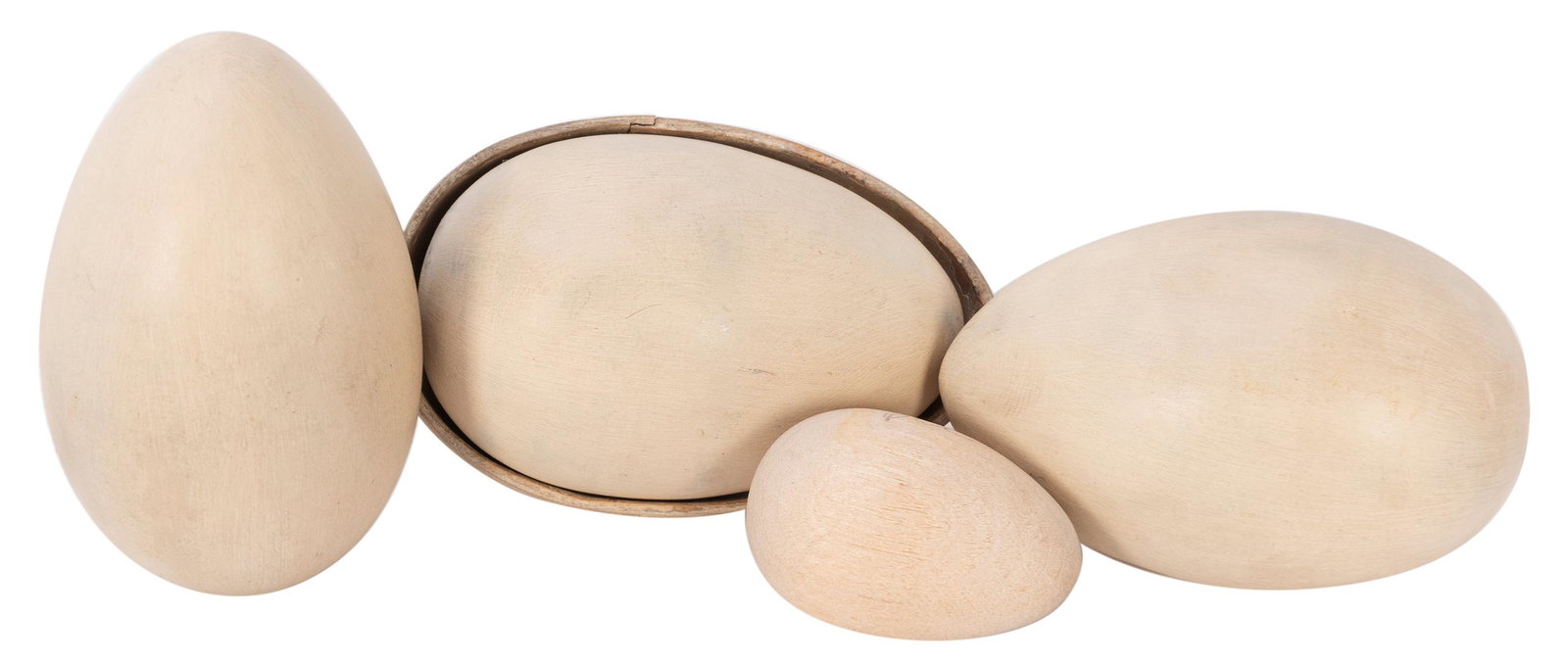 Multiplying Eggs. Los Angeles: F.G. Thayer, ca. 1930.: Multiplying Eggs. Los Angeles: F.G. Thayer, ca. 1930. Small egg multiplies from one to four between the magicianâ€™s fingers. With three turned wooden faux eggs and matching shell. Shell showing 